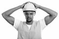 Young African man construction worker with both hands on safety helmet Royalty Free Stock Photo