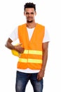 Young African man construction worker holding safety helmet Royalty Free Stock Photo