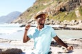 Young african man dancing at the beach Royalty Free Stock Photo