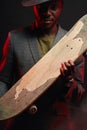 Young handsome businessman with longboard in the office Royalty Free Stock Photo