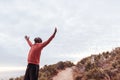 Young man standing on a trail outdoors embracing nature Royalty Free Stock Photo