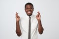 African man making a wish isolated on white background. I want to receive all i need Royalty Free Stock Photo