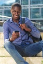 Young african man with mobile phone Royalty Free Stock Photo