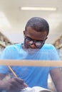 Young african man studying in library Royalty Free Stock Photo