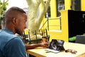 Young african man using digital tablet at a cafe Royalty Free Stock Photo