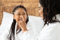 Young African Mom And Little Daughter In Bathrobes Having Fun At Home Royalty Free Stock Photo