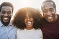 Young african people smiling on camera outdoor in the city - Focus on center girl face Royalty Free Stock Photo