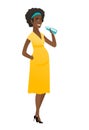 Young african pregnant woman drinking water.