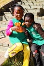 Young African Preschool children playing with animal balloons on the playground Royalty Free Stock Photo