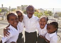 Young African schoolgirls in playground smiling to camera Royalty Free Stock Photo