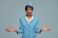 Young african stewardess giving safety briefing. Royalty Free Stock Photo