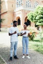 Young african two students drink coffee and disscuss in campus Uni Royalty Free Stock Photo
