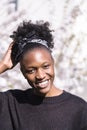 Young african woman on background of blossom tree Royalty Free Stock Photo