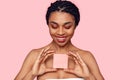 Beauty Concept. Young african woman wearing makeup isolated on pink with sticker copy space smiling happy Royalty Free Stock Photo