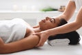 Young african woman getting body massage at spa Royalty Free Stock Photo