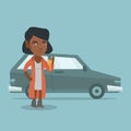 Young african woman holding keys to her new car. Royalty Free Stock Photo