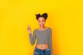 Young african woman isolated on yellow wall studio teen style cool Royalty Free Stock Photo