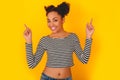Young african woman isolated on yellow wall studio teen style having fun Royalty Free Stock Photo