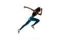 Young african woman running or jogging isolated on white studio background. Royalty Free Stock Photo