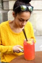 Young african woman sitting at a outdoor cafe Royalty Free Stock Photo