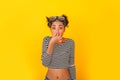 Young african woman on yellow wall studio teen style diving preparation Royalty Free Stock Photo