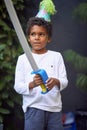 Young afro-american boy playing with plastic sword