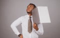 Young afro american businessman using laptop and taking notes. Royalty Free Stock Photo