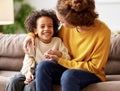 Young afro american family mother and son enjoying time together at home