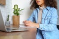 Young afro american girl student e learning watching video course making notes. Royalty Free Stock Photo