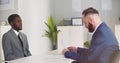 Young afro-american male candidate smiling at job interview Royalty Free Stock Photo