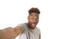 Young afro american man smiling happy taking selfie self portrait picture with mobile phone