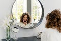 Young afro american woman in bathrobe at bathroom Royalty Free Stock Photo
