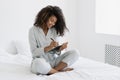 Young afro american woman writing in personal journal Royalty Free Stock Photo