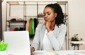 Young Afro Businesswoman Using Laptop In Clothing Store Royalty Free Stock Photo