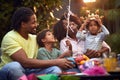 Young  afro family cuddling and smiling  at home. Enjoying and having fun together Royalty Free Stock Photo