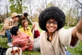 Young afro hair African American woman with group of cheerful friends taking selfie portrait. Happy people Royalty Free Stock Photo