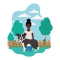 Young afro woman with cute dog in the field Royalty Free Stock Photo