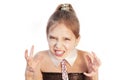 Young aggressive girl on a white background screaming and angry. Isolated
