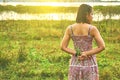 Young aisan woman standing in rim light