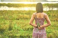 Young aisan woman standing in rim light