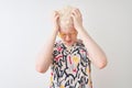 Young albino blond man wearing colorful t-shirt and sunglasses over isolated red background suffering from headache desperate and Royalty Free Stock Photo