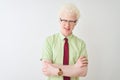 Young albino businessman wearing shirt and tie standing over isolated white background happy face smiling with crossed arms Royalty Free Stock Photo