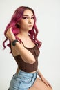 young alternative model with pink hair modeling white photography background digitals head shots