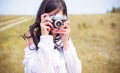 Sexy young girl in knitted with a camera clothes outdoor portrait