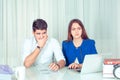 Shocked expressive man and woman watching laptop Royalty Free Stock Photo