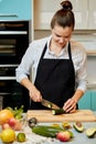 Young ambitious beautiful woman is learning to prepare tasty food