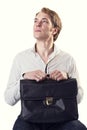 Young ambitious business man with black leather suitcase Royalty Free Stock Photo