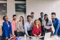 Young ambitious corporate people are posing to the camera