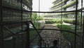 Young ambitious entrepreneur walking up the stairs in a modern office building. Concept of motivated and confident man