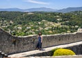 Young Amerasian touris and view of the surrounding countryside from the top of Saint Paul-De-Vence, Provence, France Royalty Free Stock Photo